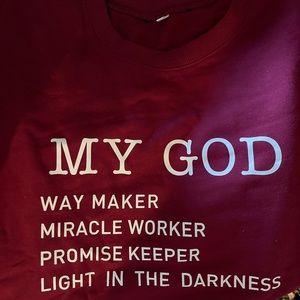 This crewneck sweatshirt is maroon not red. It fits small and was never worn.